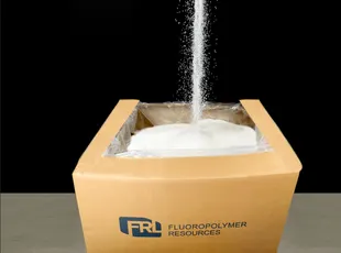 Recovered fluoropolymer pellets pouring into an FRL box